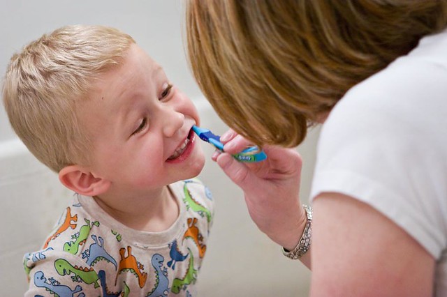 child mom tooth brush - Is Pediatric Dental Death Avoidable?
